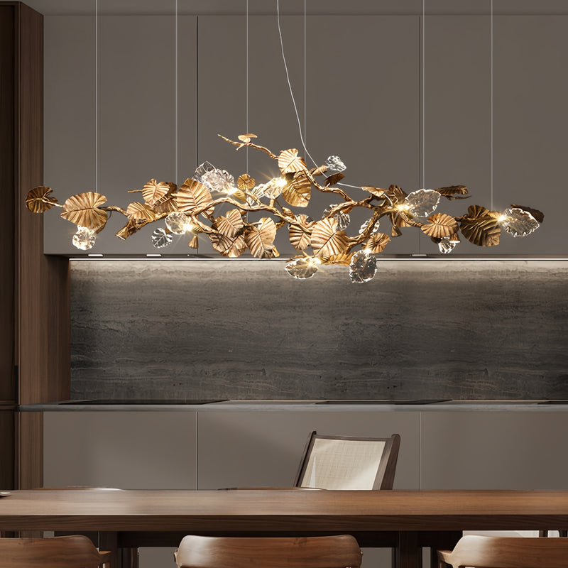 Elegant Lotus chandelier featuring delicate lotus leaf pendants made of transparent material, capturing light with a crystalline shimmer. The slender, organic brass copper branch adds warmth, while the LED lights provide a cool glow. Ideal centerpiece for a sophisticated dining area or tranquil bedroom retreat.