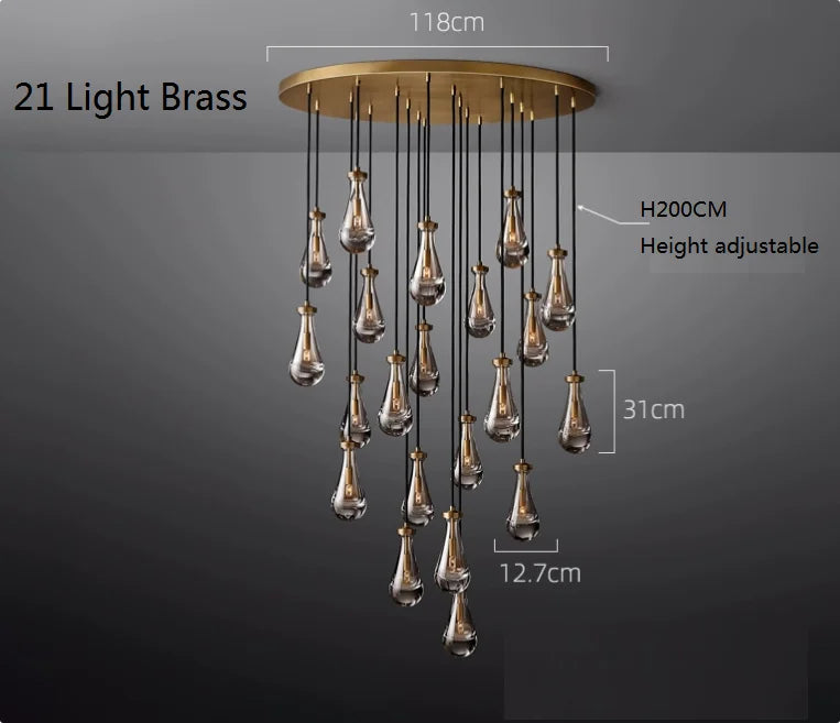 Raine Modern Chandelier with K9 crystal prisms and sleek metal design, perfect for high-ceiling living rooms, foyers, and upscale interiors. Adjustable height, energy-efficient LED compatible.