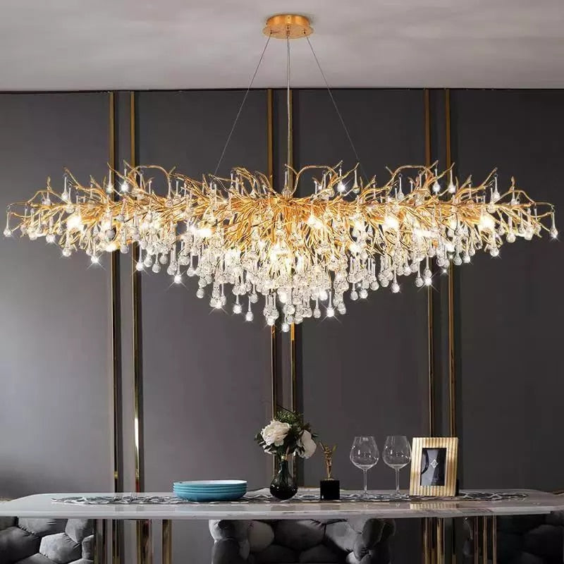 Lights of Scandinavia - ooze - "-What on earth is that majestic being hanging from the ceiling?"  Majestic crystal chandelier. Unique lighting for dining rooms, living areas, entrance halls, hotel areas, restaurants, etc.    K9 crystals with silver/gold metal plated aluminum frame. - A work of art.  2 sizes - 2 colors L120cm: L120xW50xH35cm, 12-25m2 L160cm: L160xW55xH35cm, 16kg, 15-30m2